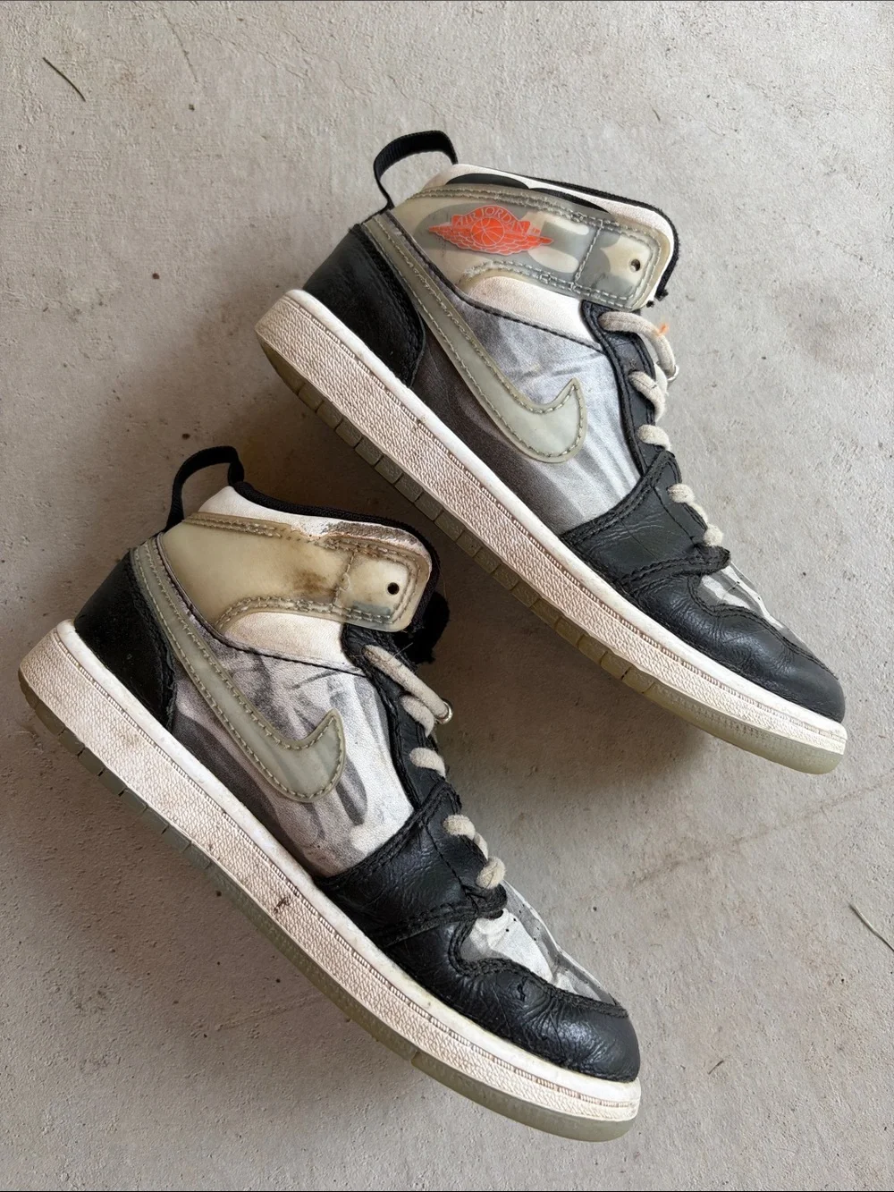 Nike Kids Black and White High-Top Sneakers with Orange Logo